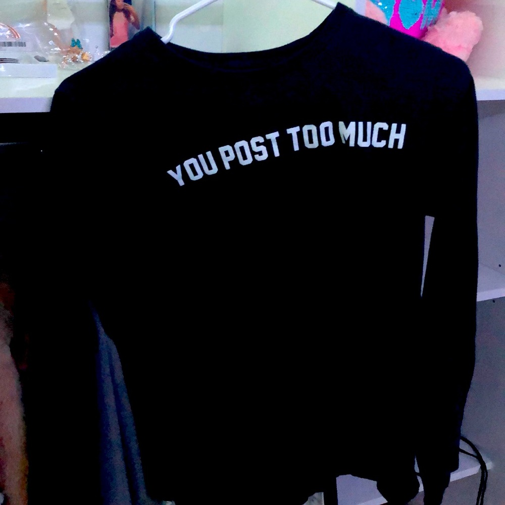A dark blue shirt says “ You Post Too Much “